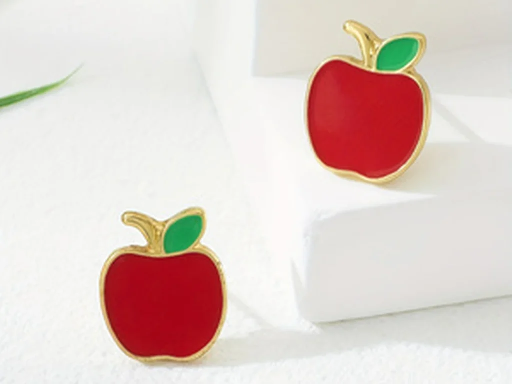 Red Apple Enamel Stud Earrings showing styling or color variation