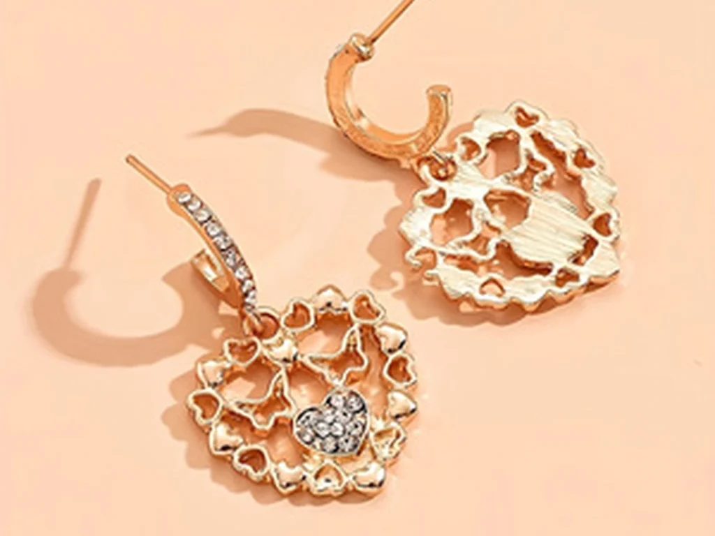 Gold-Tone Openwork Heart Drop Earrings showing styling or color variation