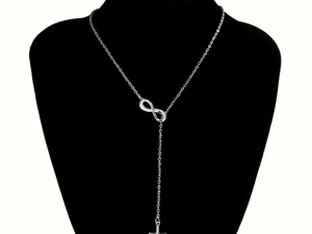Silver-tone infinity cross necklace on mannequin display