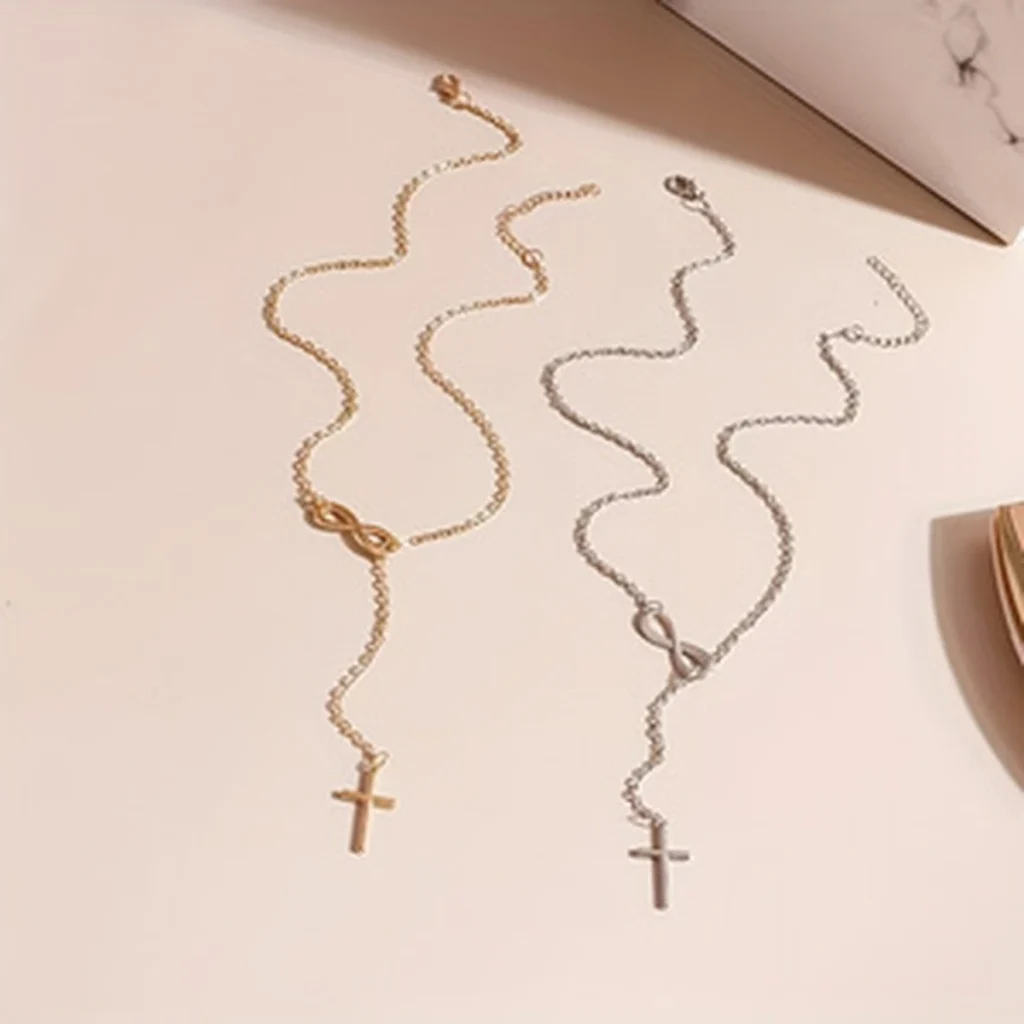 Gold-tone and silver-tone infinity cross necklaces arranged together