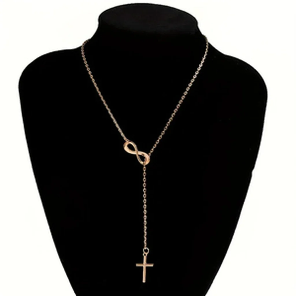 Gold-tone infinity cross necklace on mannequin display