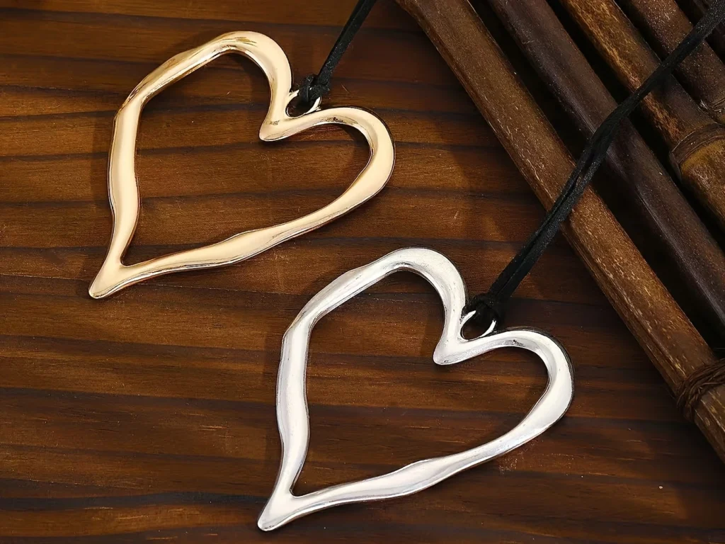 Gold-tone and silver-tone oversized heart pendant detail