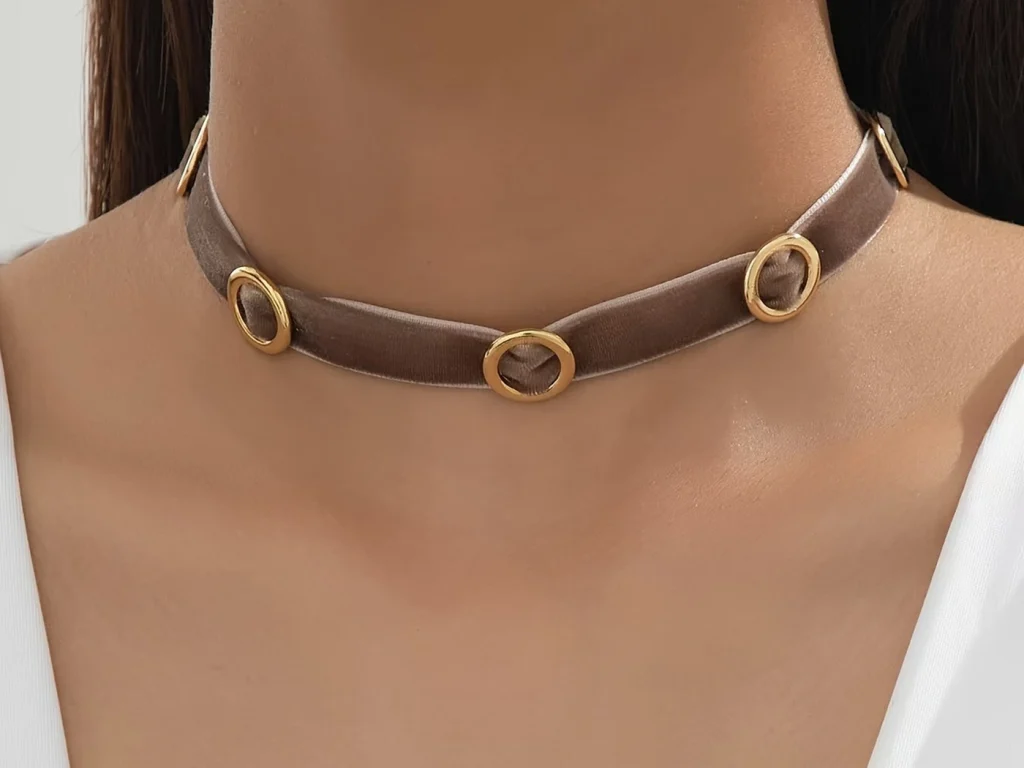 Brown velvet circle accent choker worn on a model
