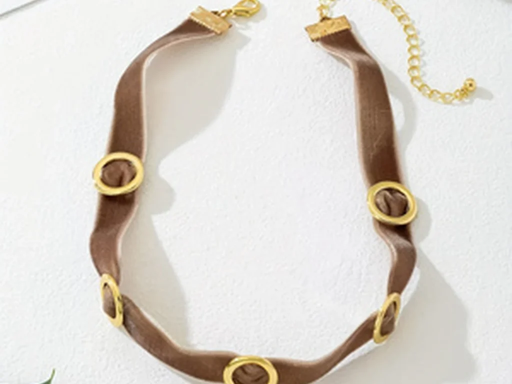 Brown velvet choker laid flat showing the full front arrangement