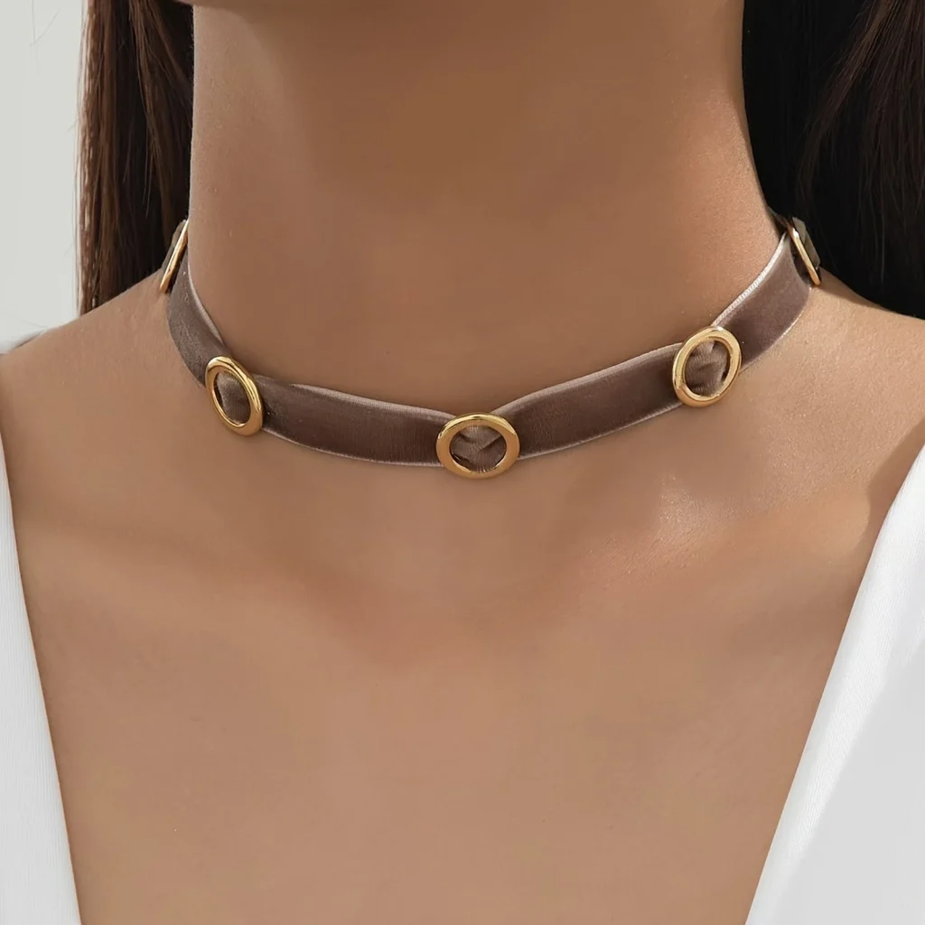 Brown velvet circle accent choker worn on a model
