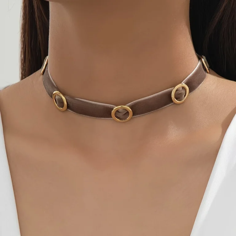 Brown velvet circle accent choker worn on a model