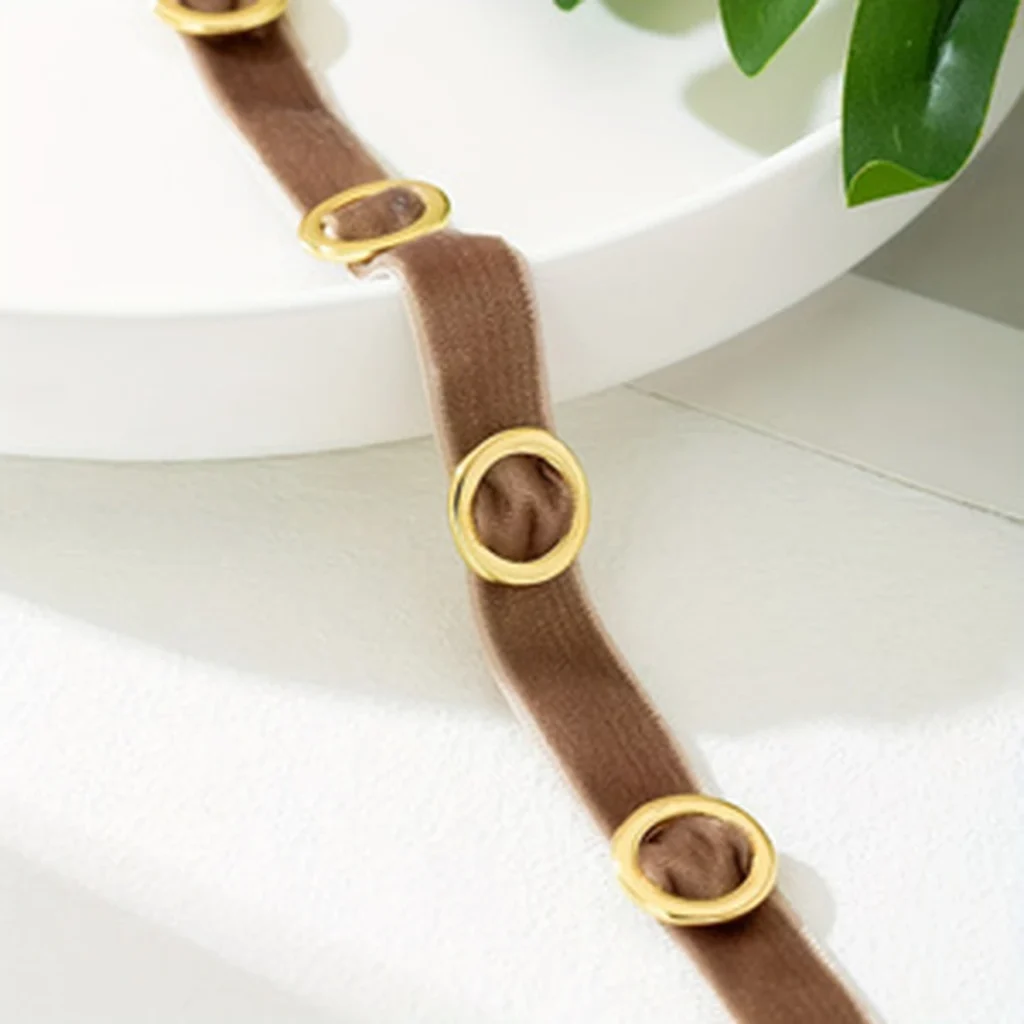 Close detail of the circular accent on the brown band
