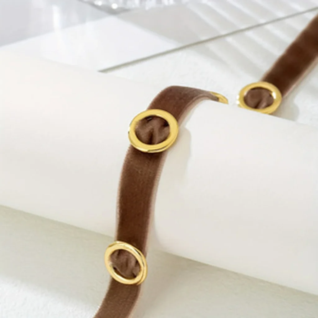 Close detail of the brown band and circular accents