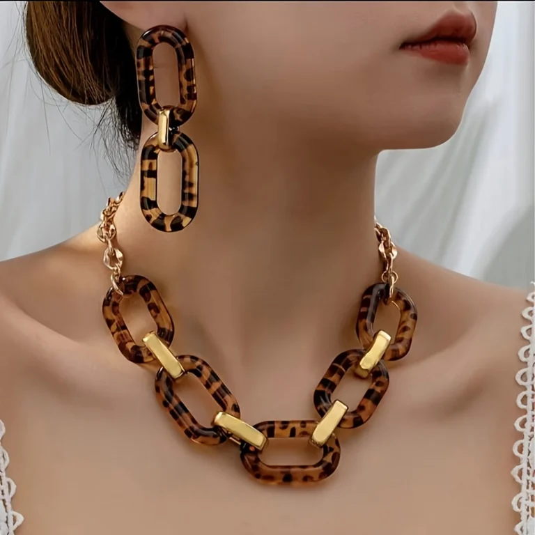 Leopard resin link necklace and earrings set worn on a model