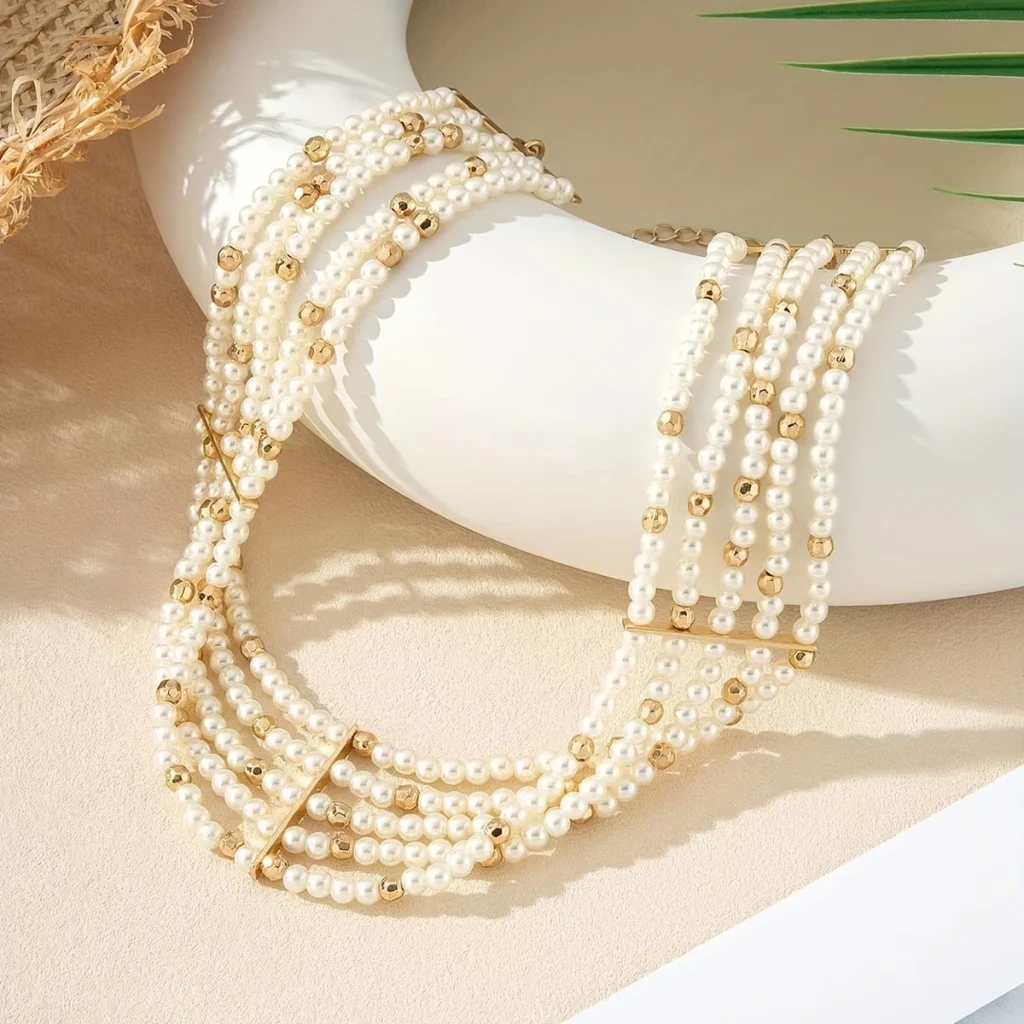Multi-strand pearl choker necklace on stand