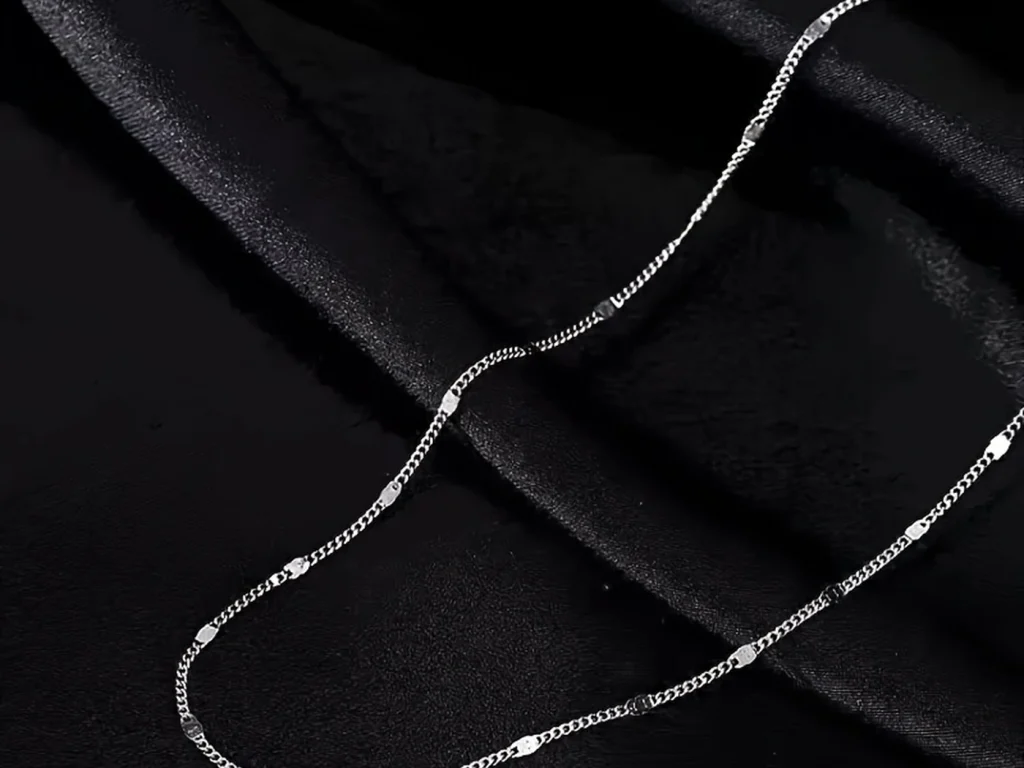 Silver-tone station necklace structure detail