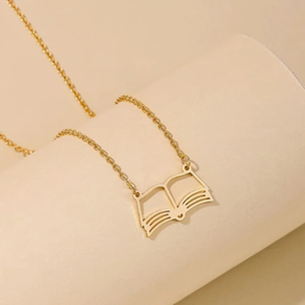 Gold-tone open book pendant necklace close front view