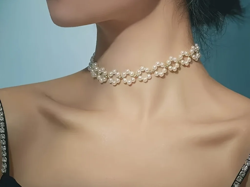 Pearl daisy choker necklace styled on a model profile