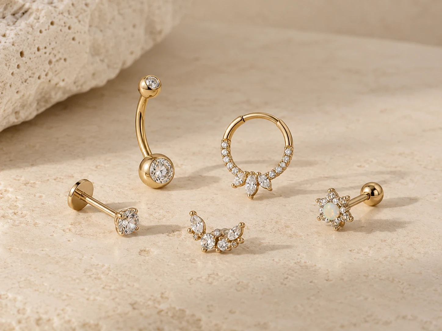 Gold-tone curved bars, flat-back posts and decorative body jewelry