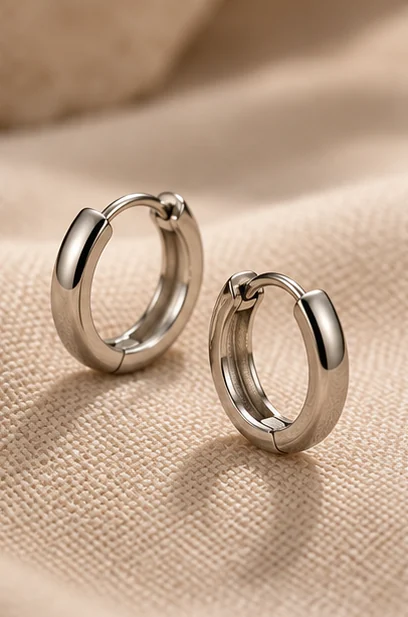 Illustrative small hoop earring pair for product-direction review