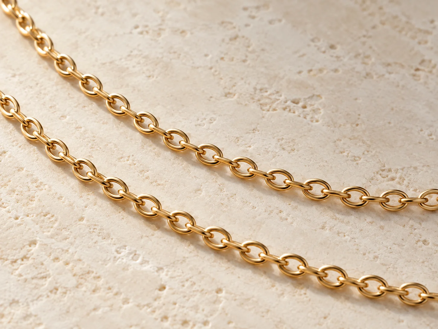 Gold-tone cable chain with repeating oval links